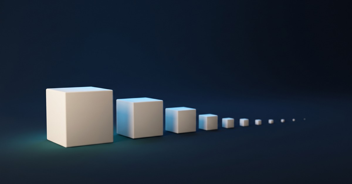 Una fila de cubos blancos sobre fondo azul oscuro, cada uno la mitad del anterior, hasta perderse como puntos en la distancia.